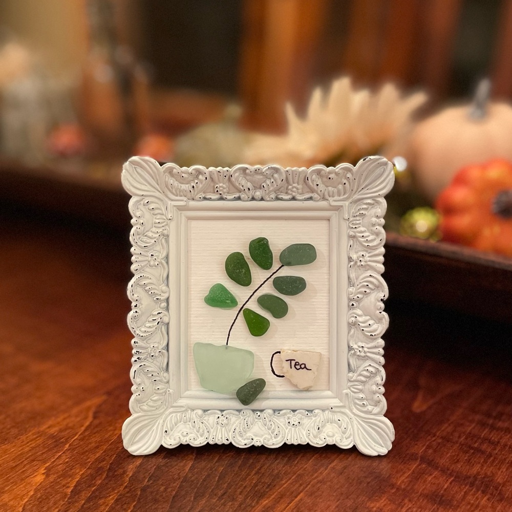 Elegant Sea Glass Art with White Frame, Green Plant and Cup of Tea!